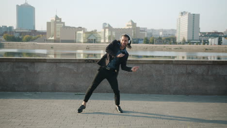 happy man dancing in the city