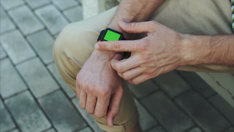 man wearing a smartwatch with green screen