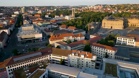 4k aerial drone video of the iconic st. john's church near the palatial residenzplatz in downotwn würzburg, germany