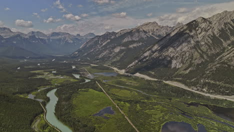 Banff-AB-Canada-Aerial-v42-drone-flyover-capturing-the-pristine-natural-environment,-winding-course-of-Bow-river,-forested-valley-and-mountain-ranges-in-summer---Shot-with-Mavic-3-Pro-Cine---July-2023