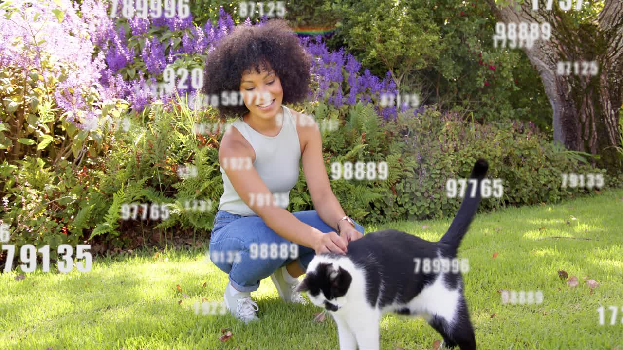 Woman crouching and petting cat in garden reaching causing tech data overlays drifting and growing