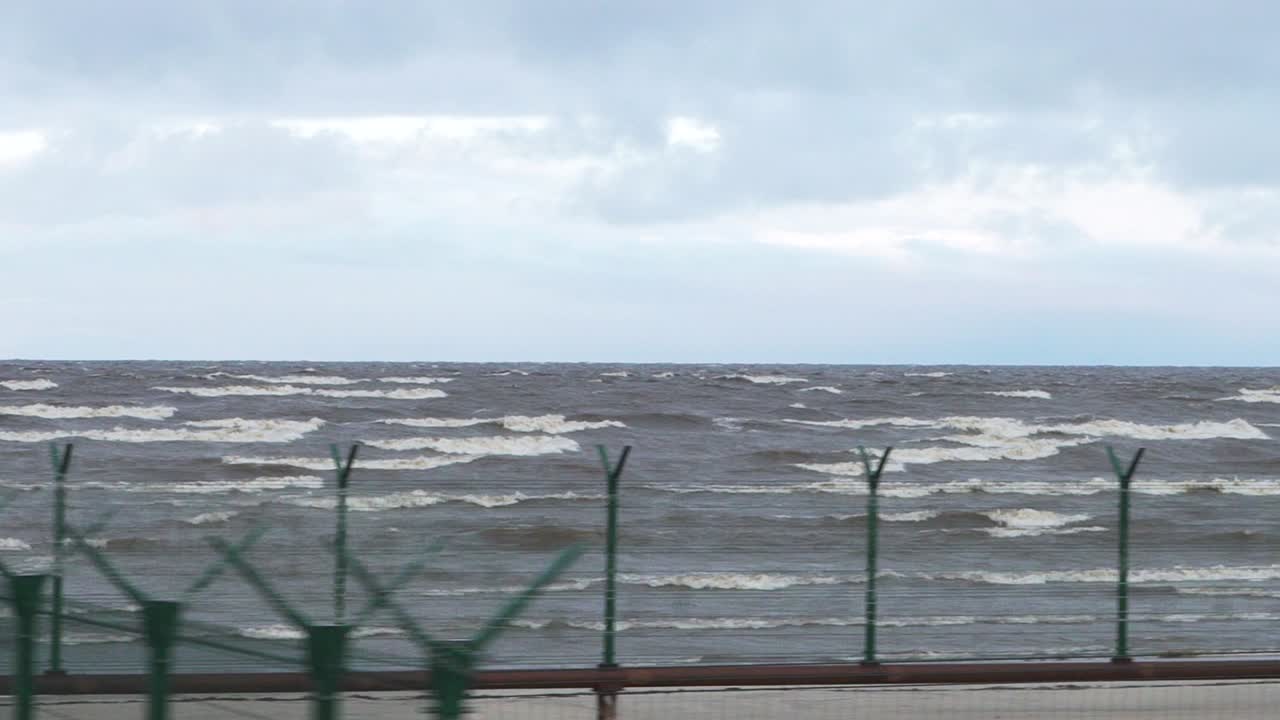 Coastal Scene with Fence and Containers
