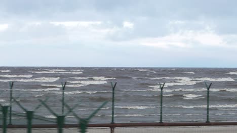 coastal scene with fence and containers