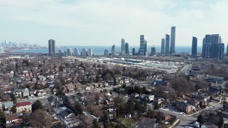 drone flying around toronto neighborhood apartment buildings near lake ontario in the spring