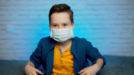 boy wearing medical mask protection coronavirus covid-19 or dust pm2.5 thumbs up safety healthy self air pollution concept