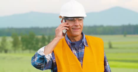 Engineer-Analyzing-Checklist-On-Clipboard-Amidst-Crops-At-Farm-9