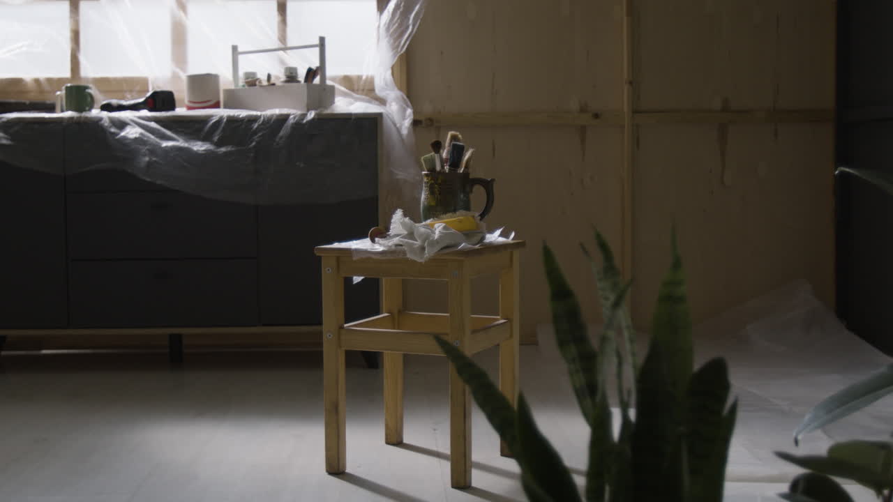 Art Studio with Painting Supplies and Covered Furniture