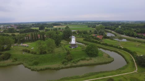 aerial shot of the historical town of veere, with an old windmill in frame