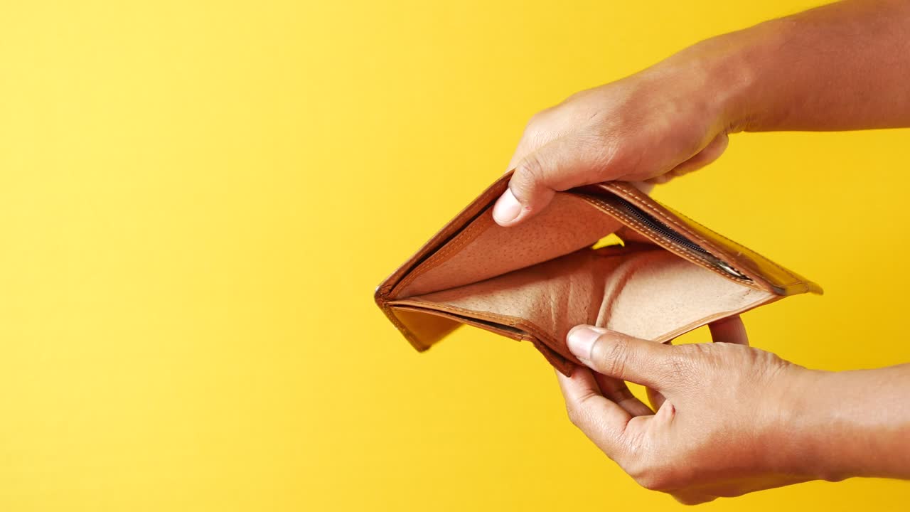 Man hand open an empty wallet with copy space