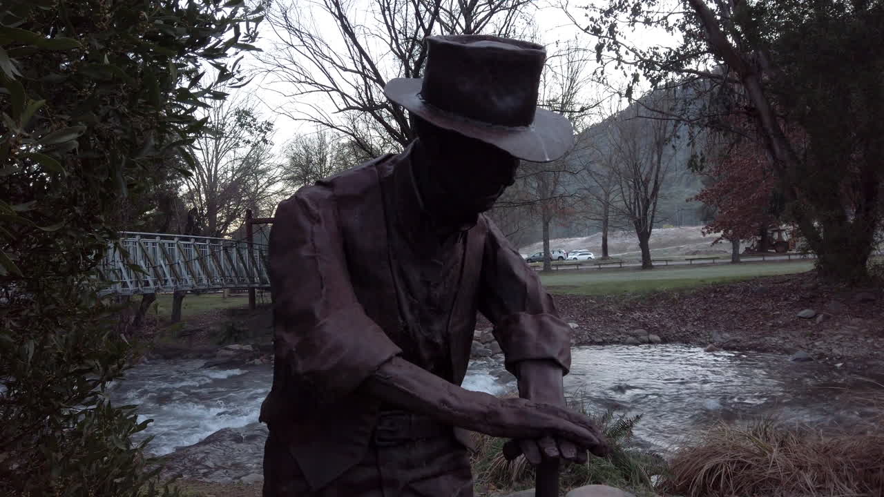 Statue of a historical man wearing a hat, Hotham, Australia, slow motion