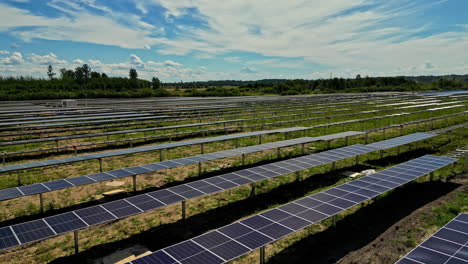 missing solar panels in large photovoltaic park, low aerial establisher