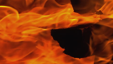 Full-frame-vertical:-Orange-flames-of-wood-fireplace-blaze-hot-fire
