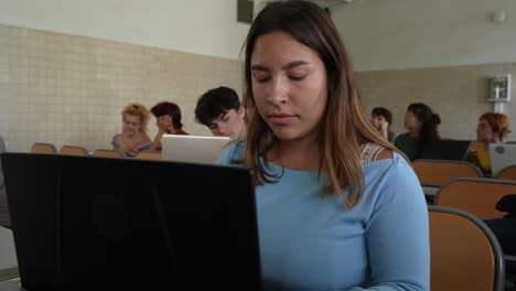 Female-student-working-on-laptop