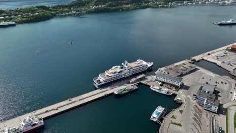 luxury cruise ship sh helena alongisde port of aalesund in norway at sunny summer day - aerial