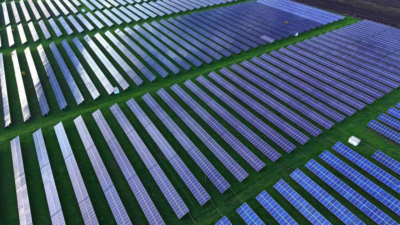Vast solar panel installation seen from above during bright daylight