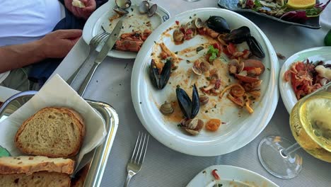 enjoying a meal with bread and wine