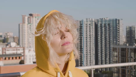 close up view of blonde woman on a terrace