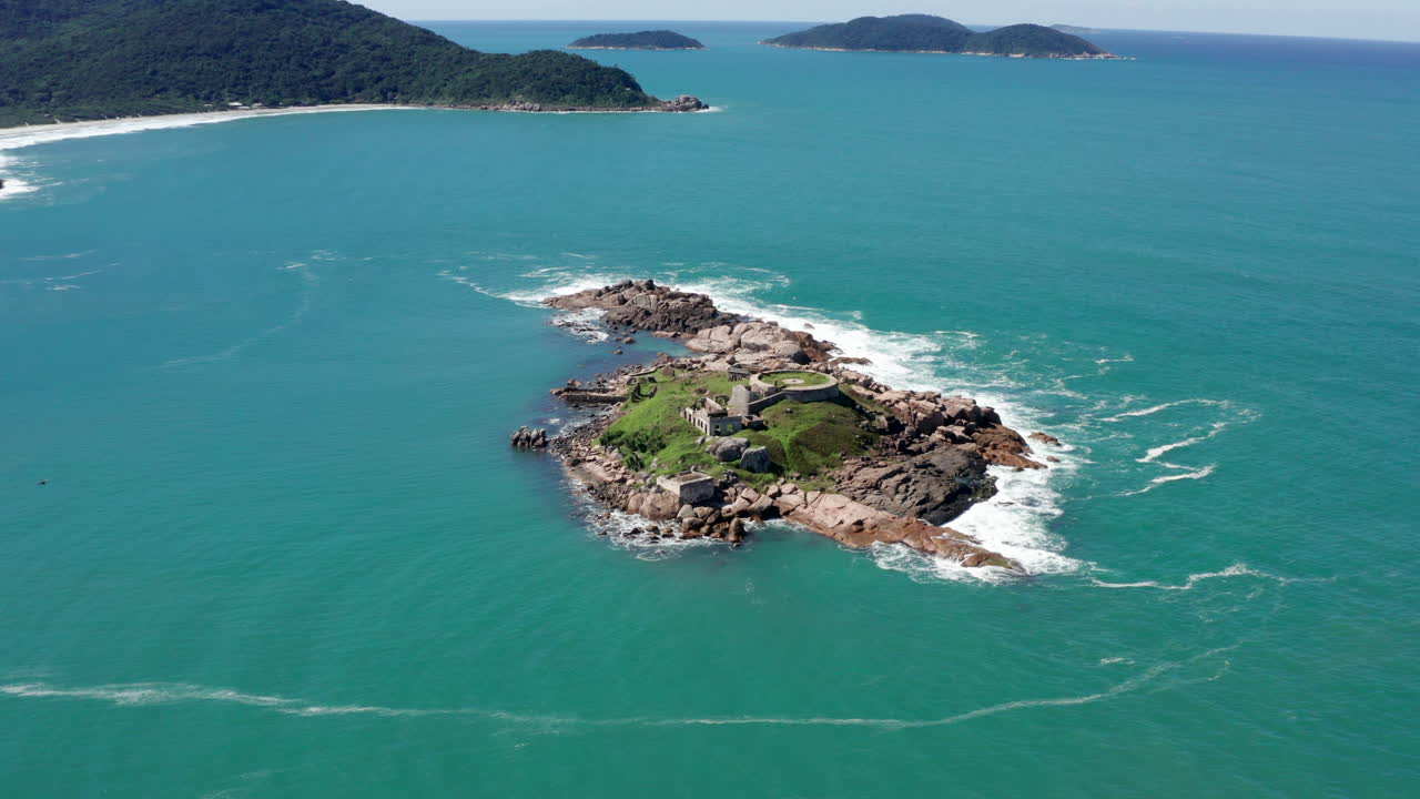 Aerial View of a Small Island with Ruins in the Ocean