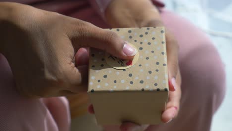 woman giving a thank you gift