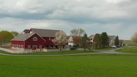 Beautiful-aerial-orbit-of-red-farm-buildings