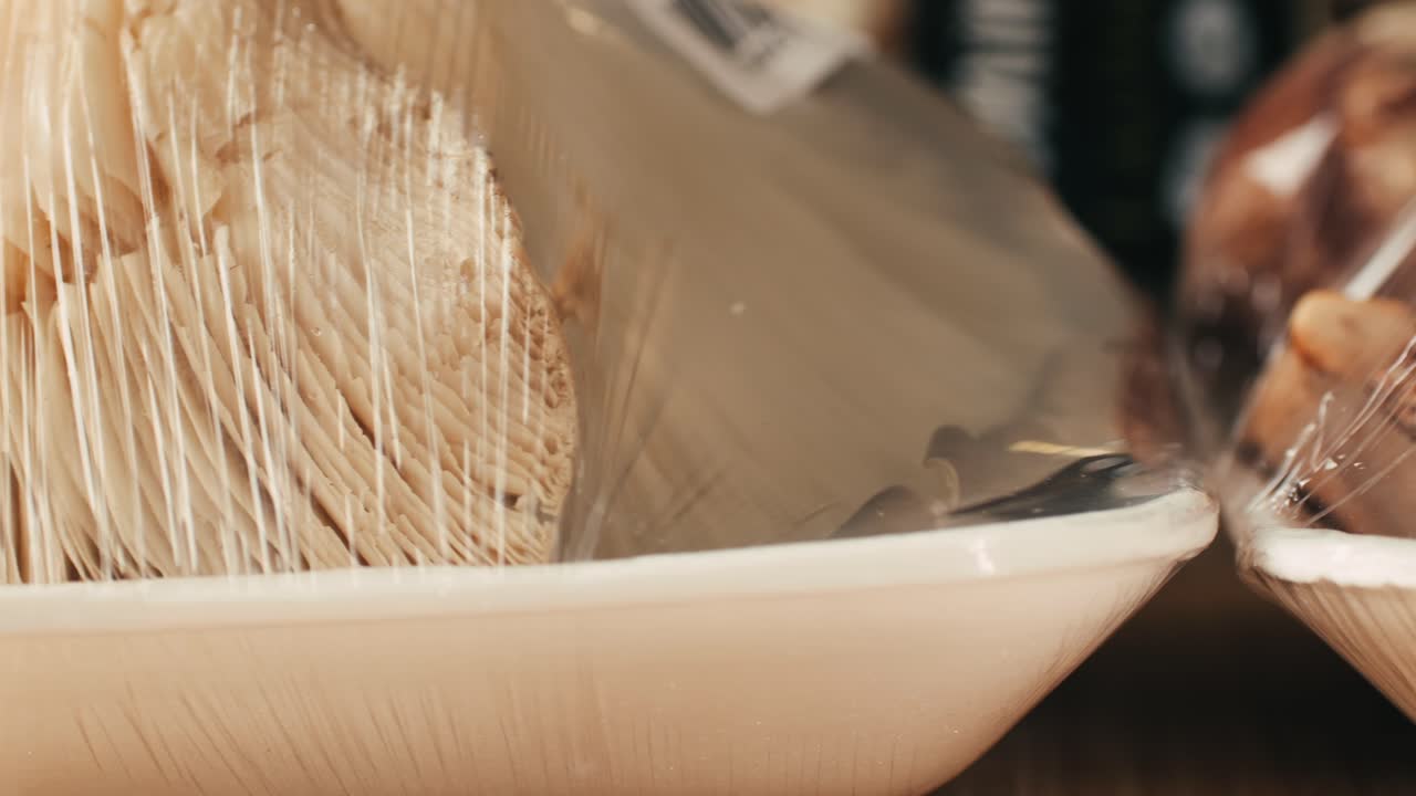 Fresh Mushrooms in Plastic Wrap