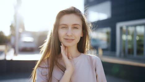 Portrait-of-gentle-female-person-looking-at-camera-with-love