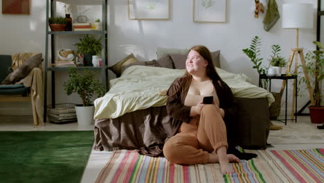 young woman sitting on the floor