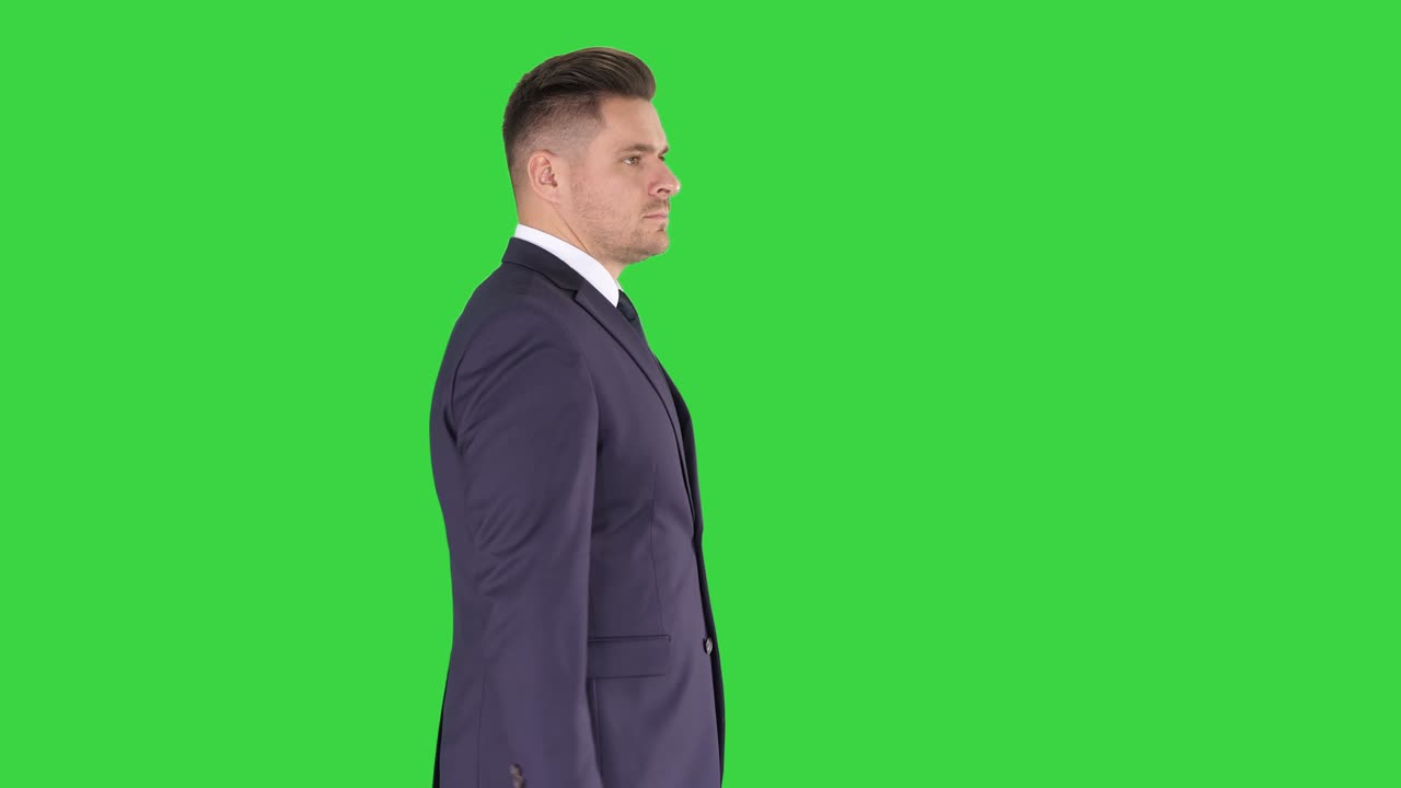 Businessman goes forward on a Green Screen, Chroma Key