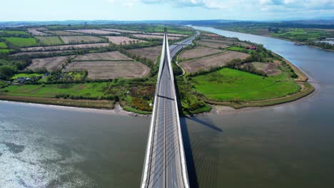 Drone-dramatic-view-of-road-users-crossing-the-Thomas-Francis-Meagher-Bridge-over-the-River-Suir-bypassing-Waterford-City-iconic-bridge-linking-Waterford-and-Kilkenny