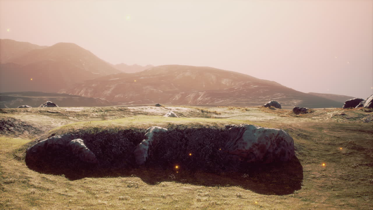 Green meadow on the background of the mountains