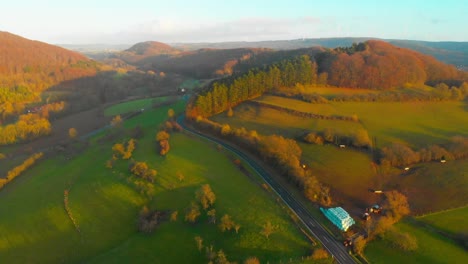 drone-flight-over-open-country-road-with-some-traffic