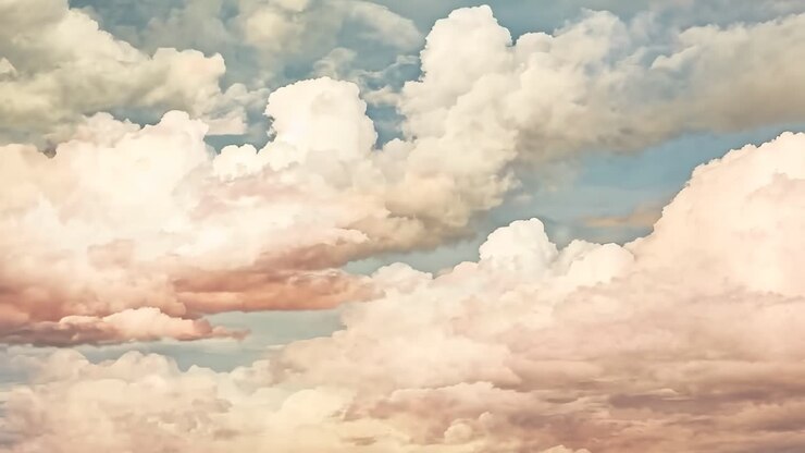 A serene video scene of soft, pastel-colored clouds viewed from a low angle, evoking a dreamy