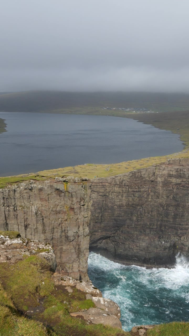Vertical View Of Faroe Islands Sea Cliffs In The North Atlantic Ocean. Aerial Shot