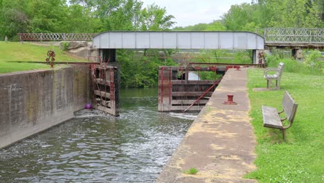 water flowing through in hennipen canal , locks are open and unused since 1951