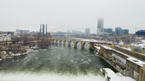 view from above saint anthony falls, minneapolis on cold foggy day