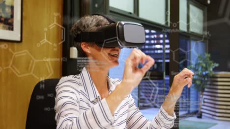 Animation-of-chemical-structures-and-data-processing-over-caucasian-woman-wearing-vr-headset