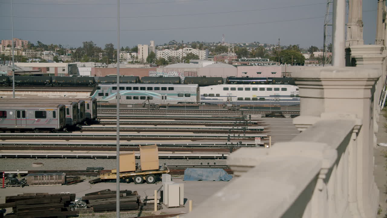 Train Yard with Multiple Tracks and Metrolink Trains