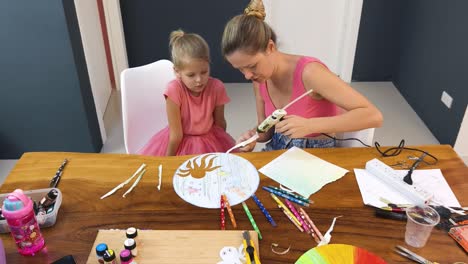 mother and daughter crafting together