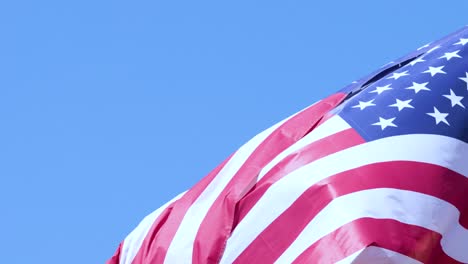 american and spanish flags waving in the wind