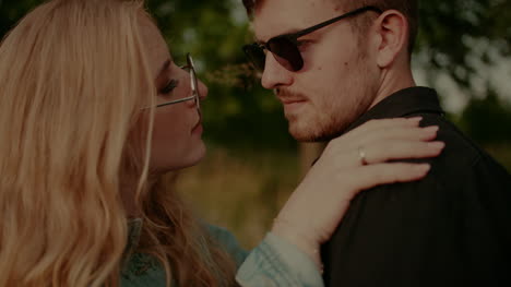 Positive-Woman-Supporting-Young-Man-Outdoors-At-Sunset-4