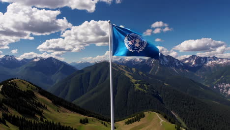 united nations flag waving over majestic mountains