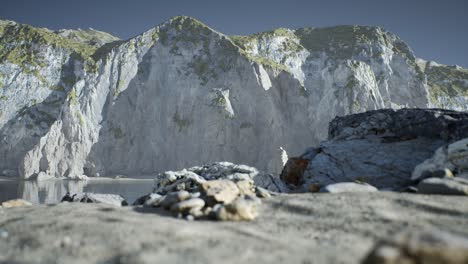 sand beach among rocks at atlantic ocean coast in portugal