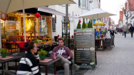 european city street scene with outdoor cafes