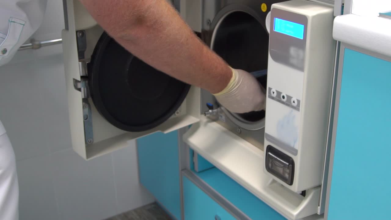 Medical Professional Using Autoclave