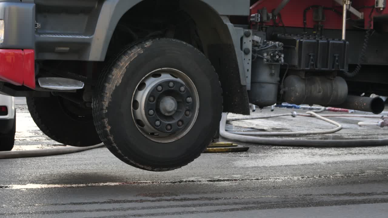 Wheel and chassis of lifted fire truck on the street, fire and rescue operation