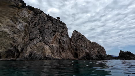 Sea Caves And Rock Cliffs - Wide Shot