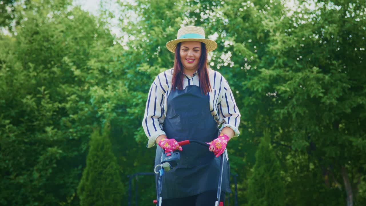 Woman Gardening with a Lawnmower