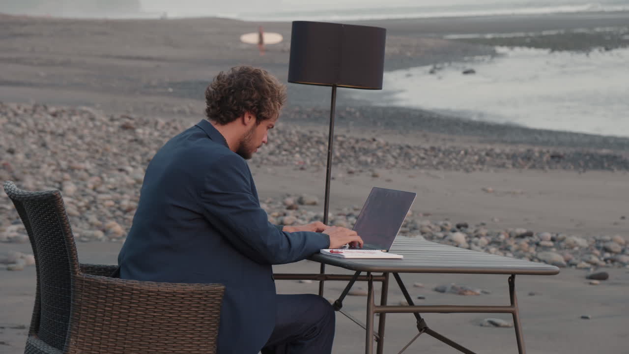 Concentrated Man Working On Beach