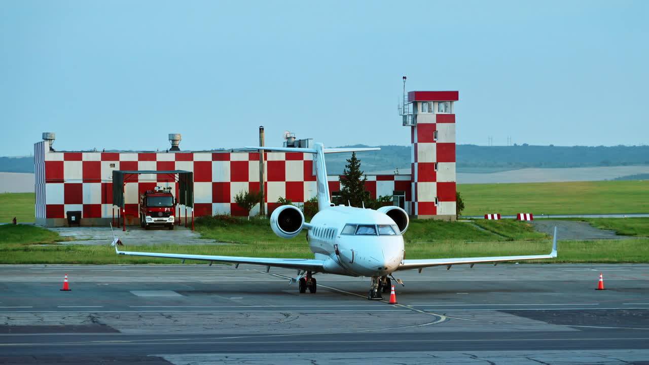 A commercial jet airplane parked on the tarmac at an airport