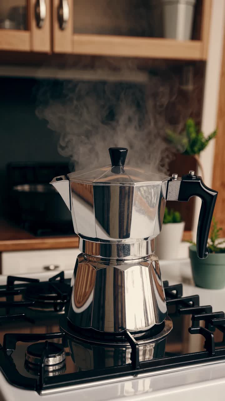A steaming stovetop espresso maker in a cozy kitchen setting. Captured from a low angle, perfect